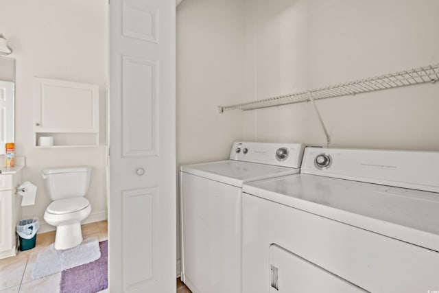 110 S Shore Blvd Unit 303, Longs, SC 29568 - laundry area featuring washing machine and dryer and light tile patterned flooring