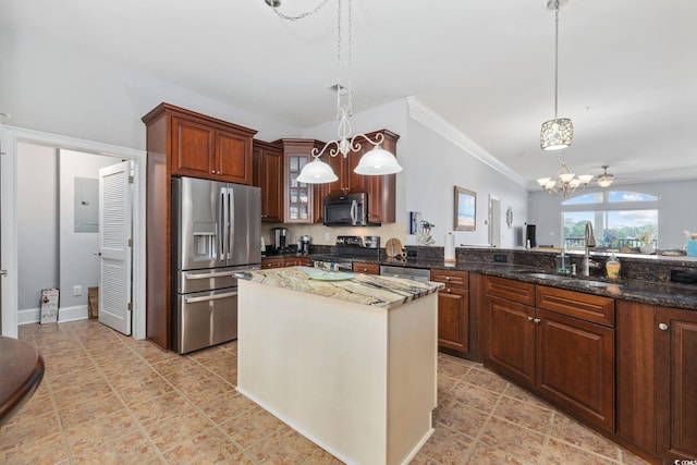 265 Venice Way Unit 1-404, Myrtle Beach, SC 29577 - kitchen featuring appliances with stainless steel finishes, a chandelier, ornamental molding, dark stone countertops, and hanging light fixtures