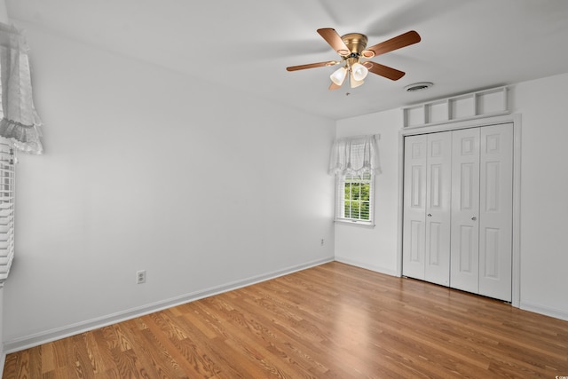 1415 Fox Hollow Way N, Myrtle Beach, SC 29582 - unfurnished bedroom featuring light wood-type flooring, a closet, and a ceiling fan