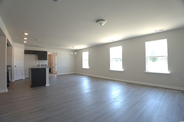 205 Kc Ln, Aynor, SC 29511 - unfurnished living room featuring a chandelier, dark wood-style flooring, and recessed lighting