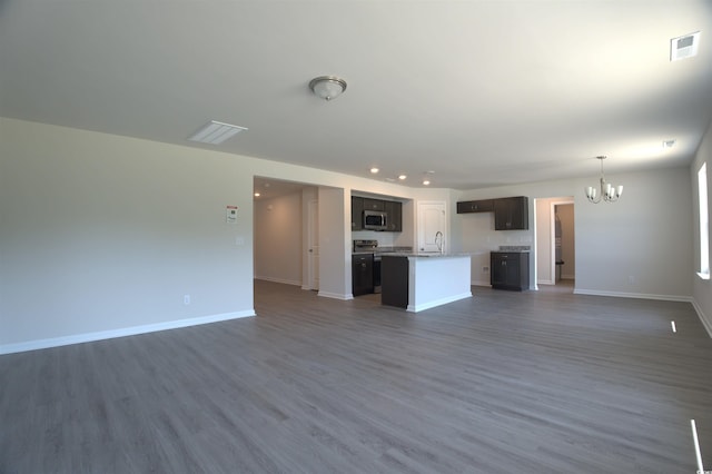 205 Kc Ln, Aynor, SC 29511 - unfurnished living room featuring a chandelier, dark wood-style floors, and recessed lighting