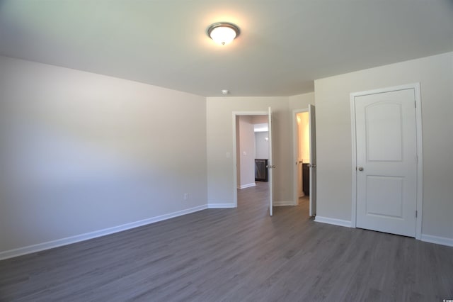 205 Kc Ln, Aynor, SC 29511 - unfurnished bedroom with dark wood-type flooring and baseboards