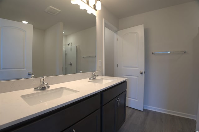 205 Kc Ln, Aynor, SC 29511 - full bathroom featuring double vanity, a shower, wood finished floors, and recessed lighting