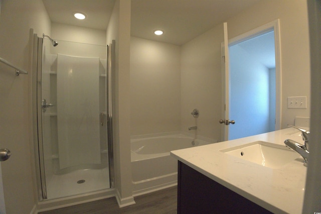 205 Kc Ln, Aynor, SC 29511 - full bathroom featuring wood finished floors, a shower stall, a garden tub, vanity, and recessed lighting