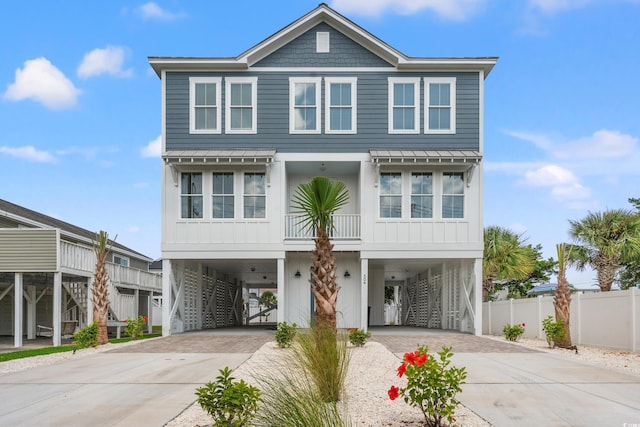 304 29th Ave N, North Myrtle Beach, SC 29582 - coastal home with a carport, stairs, and driveway