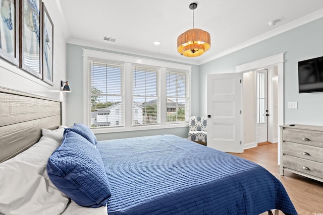 304 29th Ave N, North Myrtle Beach, SC 29582 - bedroom featuring ornamental molding and light wood finished floors