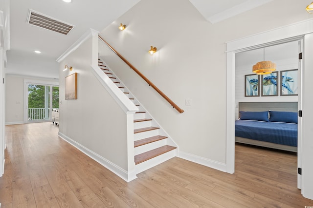 304 29th Ave N, North Myrtle Beach, SC 29582 - staircase with wood finished floors, recessed lighting, and ornamental molding