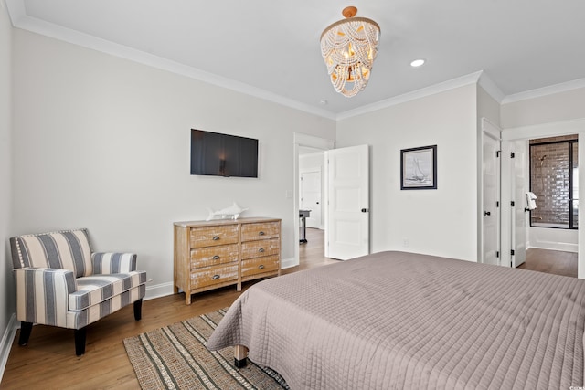 304 29th Ave N, North Myrtle Beach, SC 29582 - bedroom with a chandelier, crown molding, wood finished floors, recessed lighting, and connected bathroom