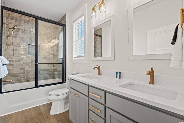 304 29th Ave N, North Myrtle Beach, SC 29582 - bathroom featuring wood finished floors, enclosed tub / shower combo, and double vanity