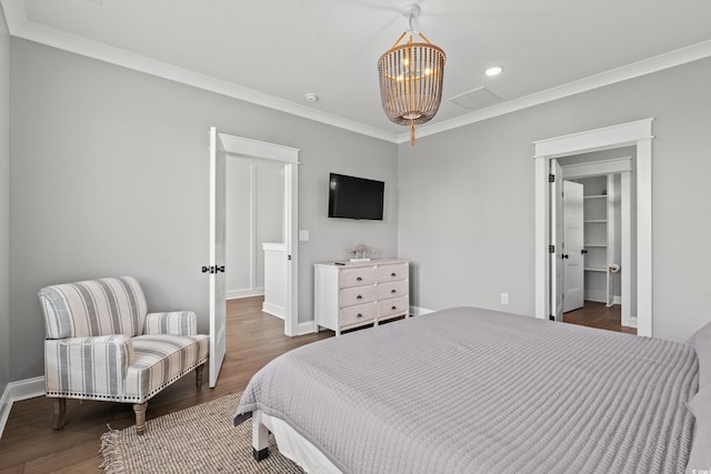 304 29th Ave N, North Myrtle Beach, SC 29582 - bedroom featuring wood finished floors, crown molding, and recessed lighting