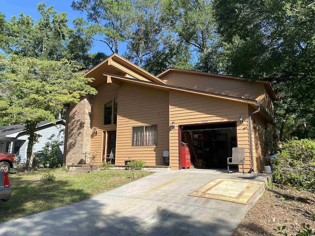 2232 Franklin Cir, Little River, SC 29566 - view of front facade with a garage and concrete driveway