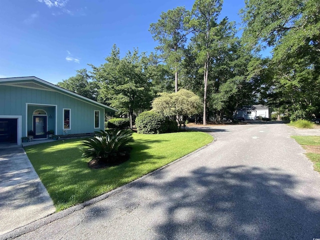 2232 Franklin Cir, Little River, SC 29566 - view of side of home featuring a lawn