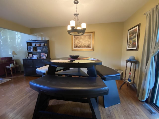 2232 Franklin Cir, Little River, SC 29566 - dining area featuring a chandelier and dark wood-type flooring