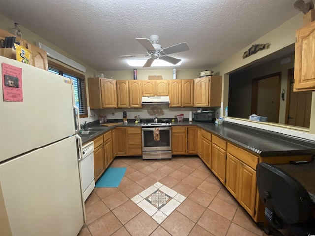 2232 Franklin Cir, Little River, SC 29566 - kitchen featuring white appliances, light tile patterned flooring, a textured ceiling, ceiling fan, and under cabinet range hood