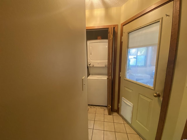 2232 Franklin Cir, Little River, SC 29566 - washroom with stacked washer / drying machine and light tile patterned floors