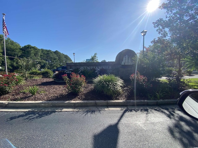 2232 Franklin Cir, Little River, SC 29566 - view of asphalt road with curbs and street lights