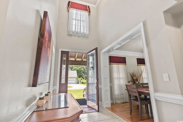 1504 27th Ave N, North Myrtle Beach, SC 29582 - entryway with crown molding, a high ceiling, and tile patterned flooring
