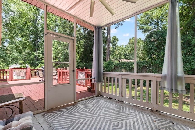 1504 27th Ave N, North Myrtle Beach, SC 29582 - unfurnished sunroom featuring ceiling fan and view of scattered trees