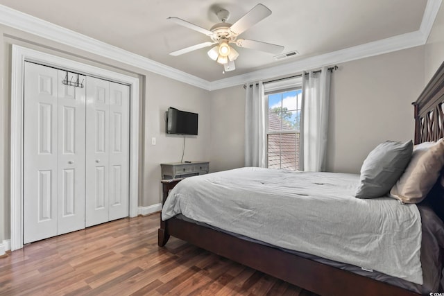 1504 27th Ave N, North Myrtle Beach, SC 29582 - bedroom with wood finished floors, ornamental molding, a closet, and ceiling fan