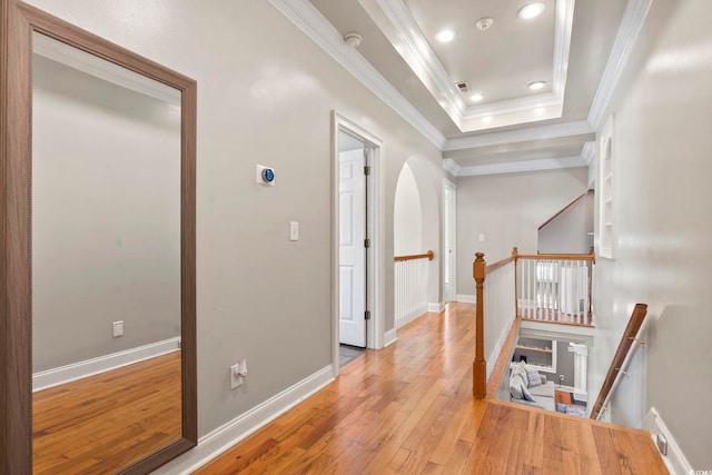 1504 27th Ave N, North Myrtle Beach, SC 29582 - hall featuring crown molding, wood finished floors, an upstairs landing, a tray ceiling, and recessed lighting