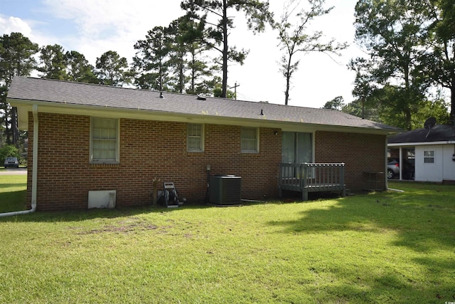 240 Yadkin Ave, Georgetown, SC 29440 - rear view of property with brick siding, a lawn, and a shingled roof