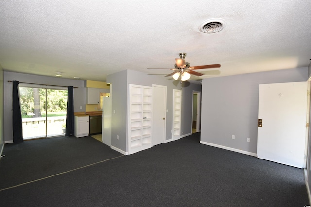 240 Yadkin Ave, Georgetown, SC 29440 - unfurnished living room featuring a ceiling fan, a textured ceiling, dark colored carpet, and built in features