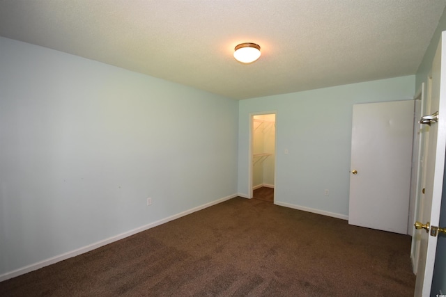 240 Yadkin Ave, Georgetown, SC 29440 - unfurnished bedroom featuring dark colored carpet and a spacious closet