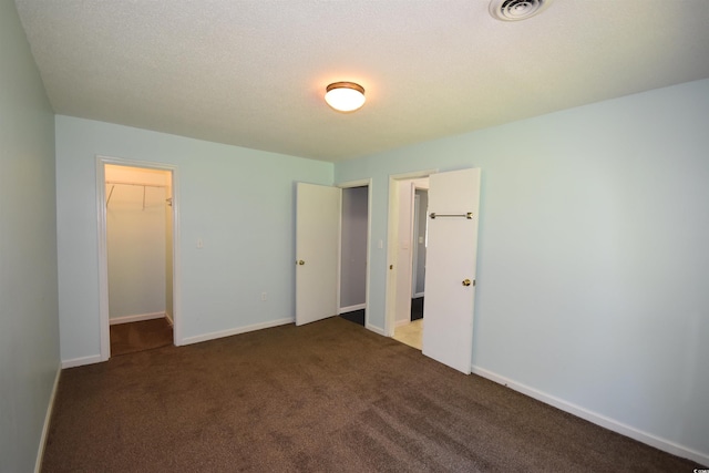 240 Yadkin Ave, Georgetown, SC 29440 - unfurnished bedroom with a walk in closet and carpet flooring