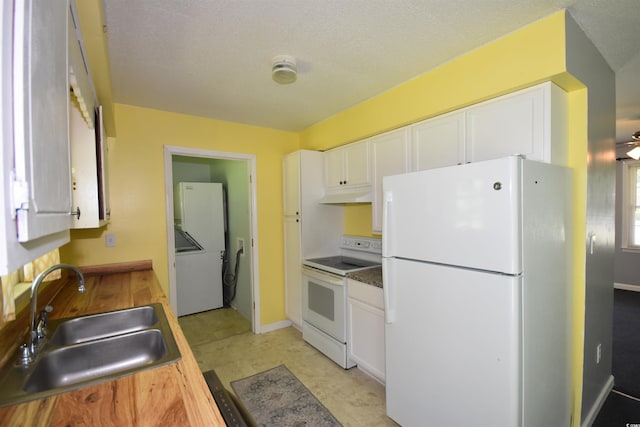 240 Yadkin Ave, Georgetown, SC 29440 - kitchen featuring white appliances, under cabinet range hood, and white cabinetry
