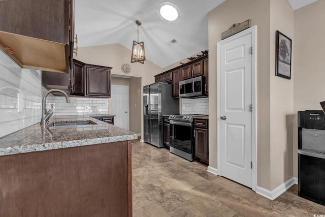 3922 Glenmere Dr, Myrtle Beach, SC 29588 - kitchen featuring appliances with stainless steel finishes, dark brown cabinets, light stone countertops, backsplash, and lofted ceiling