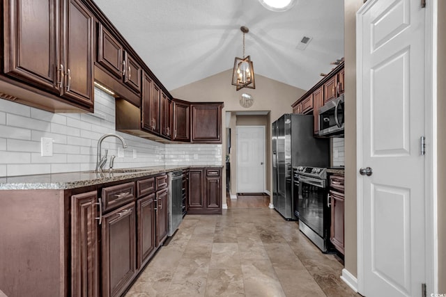 3922 Glenmere Dr, Myrtle Beach, SC 29588 - kitchen featuring appliances with stainless steel finishes, dark brown cabinets, vaulted ceiling, light stone countertops, and tasteful backsplash