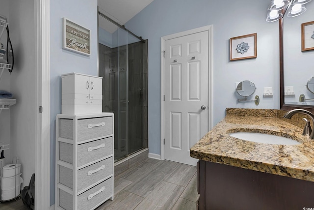 3922 Glenmere Dr, Myrtle Beach, SC 29588 - bathroom with vanity, a stall shower, and wood finished floors