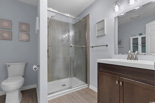 3922 Glenmere Dr, Myrtle Beach, SC 29588 - bathroom featuring wood finished floors, vanity, and a stall shower