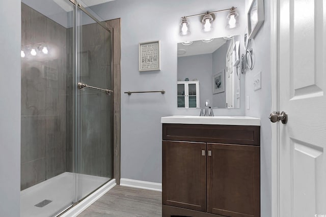 3922 Glenmere Dr, Myrtle Beach, SC 29588 - bathroom featuring a stall shower, vanity, and wood finished floors