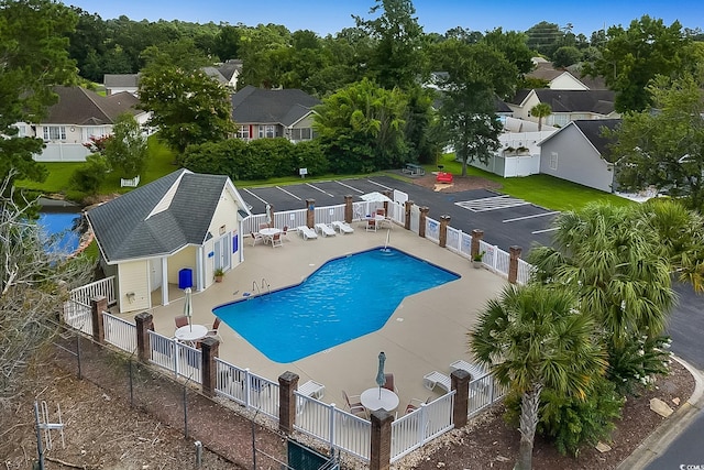 3922 Glenmere Dr, Myrtle Beach, SC 29588 - community pool with a fenced backyard, a patio, and a residential view
