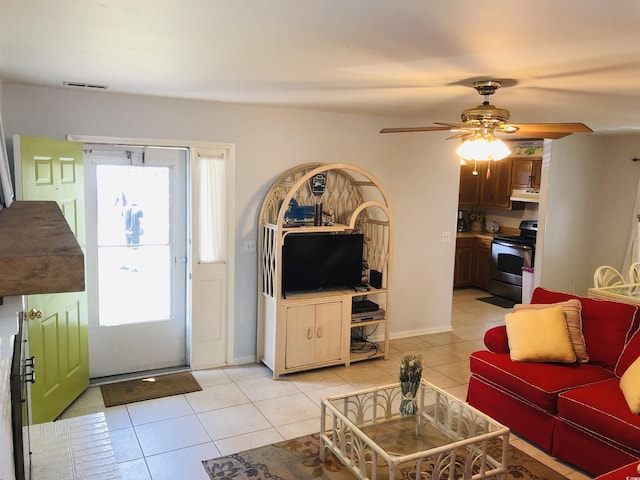910 Perrin Dr, North Myrtle Beach, SC 29582 - living room with light tile patterned floors, plenty of natural light, and ceiling fan