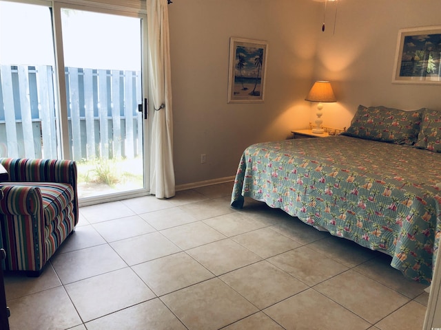 910 Perrin Dr, North Myrtle Beach, SC 29582 - bedroom featuring multiple windows, tile patterned floors, and access to outside