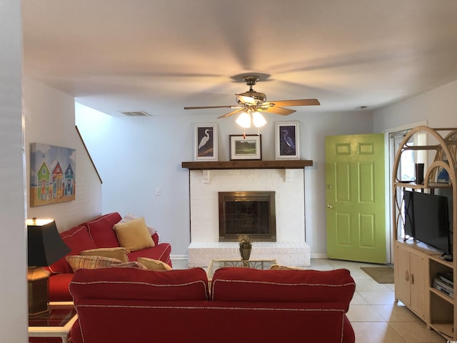 910 Perrin Dr, North Myrtle Beach, SC 29582 - living room with light tile patterned flooring, ceiling fan, and a fireplace