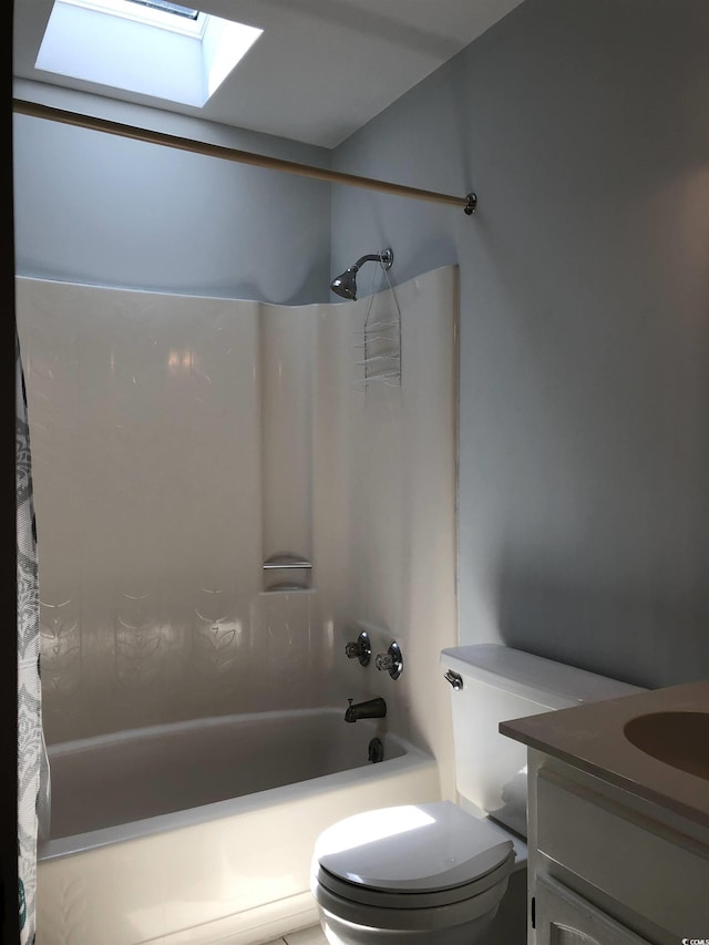 910 Perrin Dr, North Myrtle Beach, SC 29582 - bathroom featuring shower / bath combo with shower curtain, a skylight, and vanity