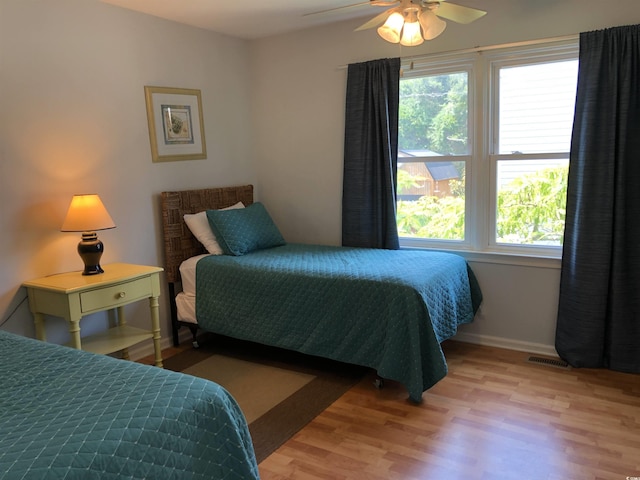 910 Perrin Dr, North Myrtle Beach, SC 29582 - bedroom with wood finished floors and baseboards
