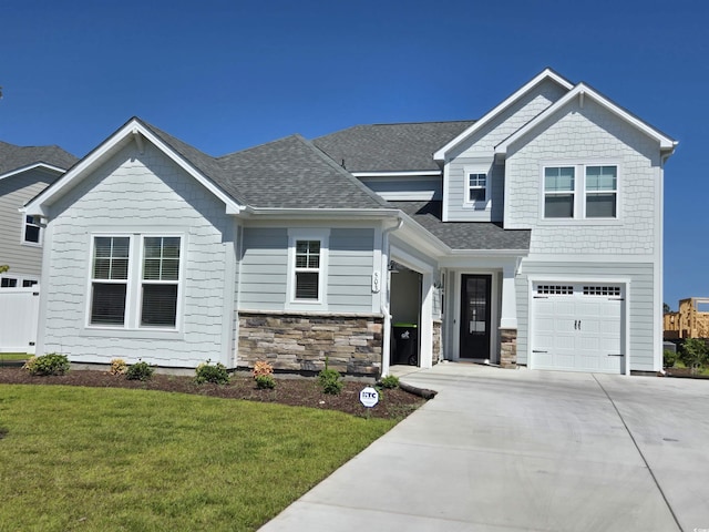 350 Starlit Way, Myrtle Beach, SC 29579 - craftsman inspired home featuring concrete driveway, a front yard, a shingled roof, an attached garage, and stone siding