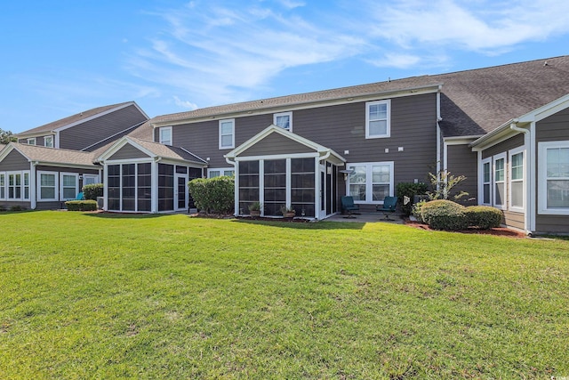 6014 Catalina Dr Unit 413, North Myrtle Beach, SC 29582 - back of property with a sunroom and a lawn