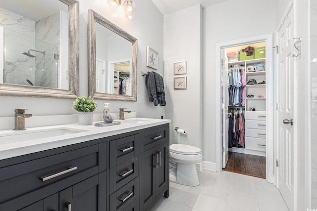 6014 Catalina Dr Unit 413, North Myrtle Beach, SC 29582 - bathroom featuring double vanity, a marble finish shower, and a spacious closet