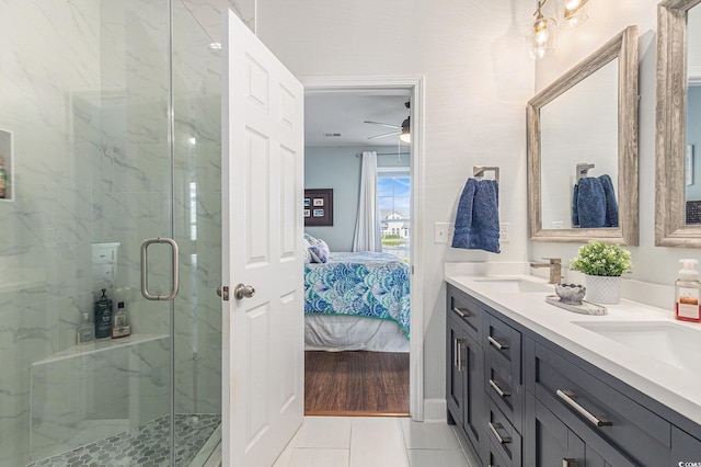 6014 Catalina Dr Unit 413, North Myrtle Beach, SC 29582 - ensuite bathroom featuring tile patterned floors, a marble finish shower, double vanity, and ceiling fan