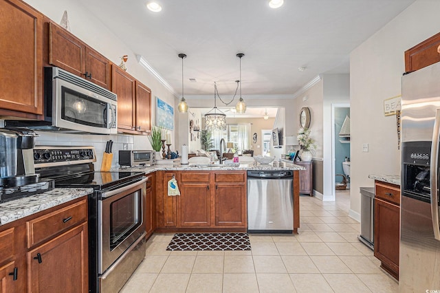 6014 Catalina Dr Unit 413, North Myrtle Beach, SC 29582 - kitchen with appliances with stainless steel finishes, a peninsula, light tile patterned floors, crown molding, and open floor plan