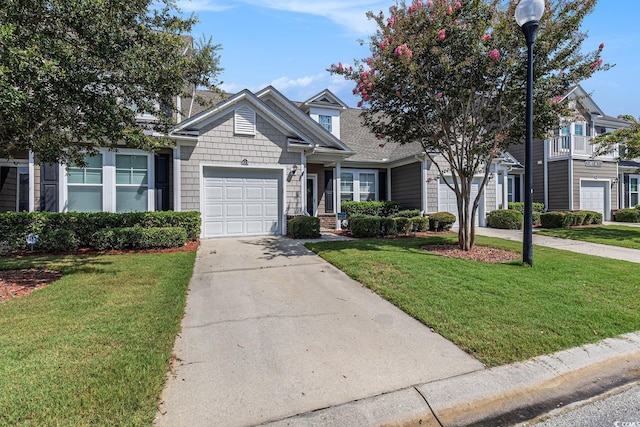 6014 Catalina Dr Unit 413, North Myrtle Beach, SC 29582 - view of front of property with concrete driveway, an attached garage, and a front yard