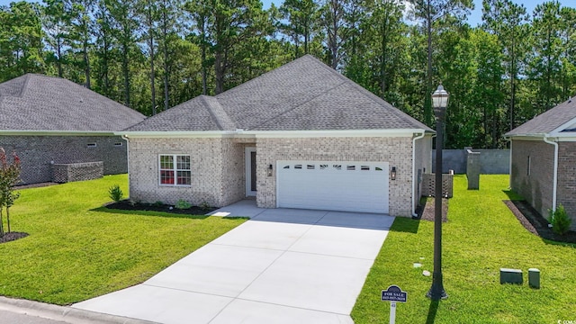 293 Waterfall Cir, Little River, SC 29566 - view of front of property with a garage, driveway, a front lawn, brick siding, and roof with shingles
