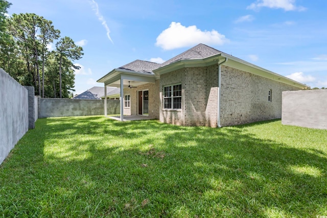 293 Waterfall Cir, Little River, SC 29566 - rear view of property featuring a ceiling fan, brick siding, a patio, and a fenced backyard