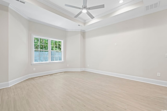 293 Waterfall Cir, Little River, SC 29566 - spare room with ornamental molding, light wood finished floors, a tray ceiling, a ceiling fan, and recessed lighting