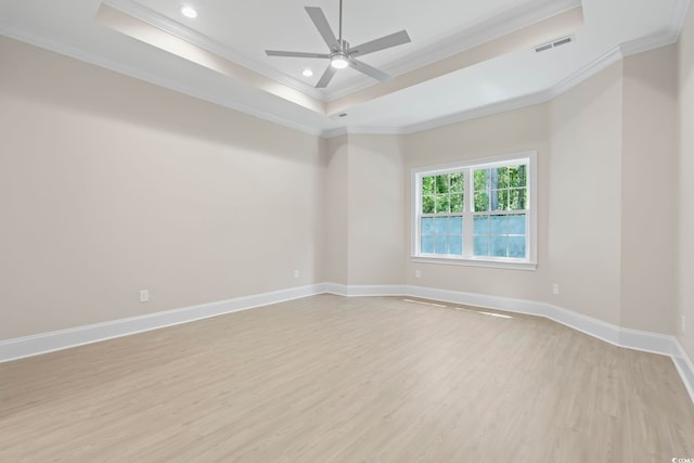 293 Waterfall Cir, Little River, SC 29566 - spare room with crown molding, a tray ceiling, light wood-style flooring, a ceiling fan, and recessed lighting